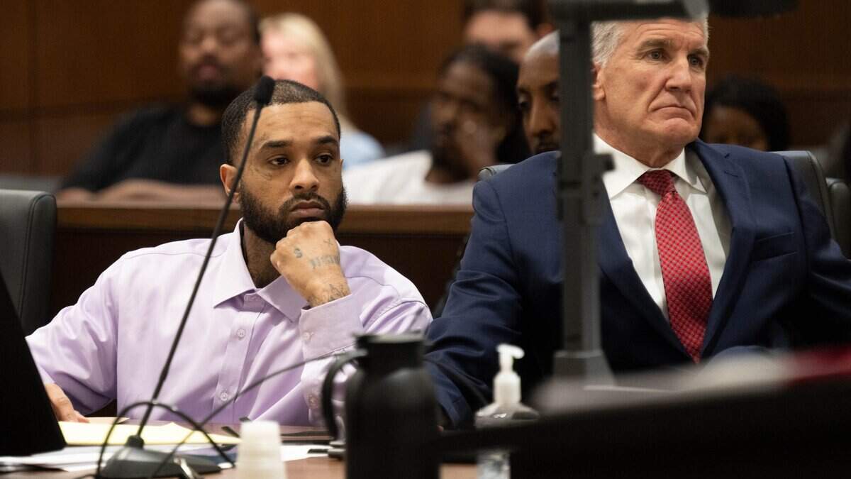 Defense attorney Reid Kingsbury and his client Mtula Payton, who is accused of murder in the April 2022 K Street mass shooting, listen to defense attorney Linda Parisi during closing arguments at Sacramento Superior Court on Wednesday in Sacramento.