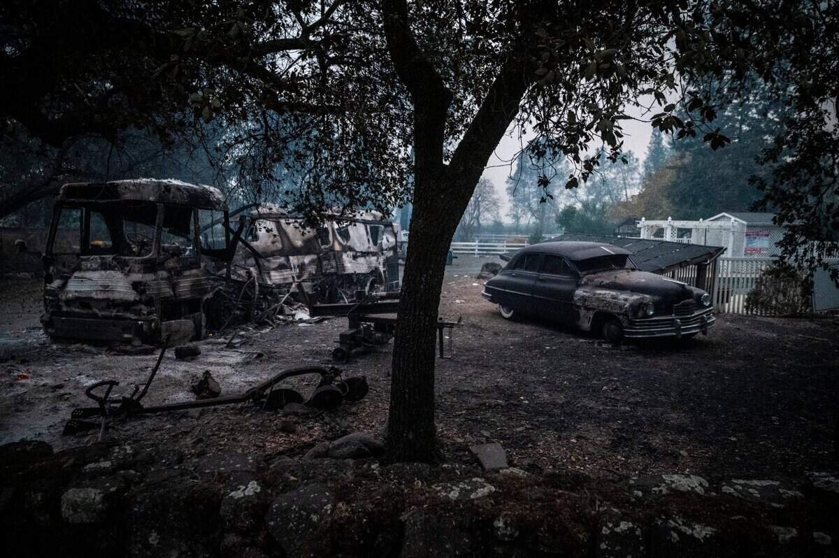 Burn cars sit in front of a home in Calistoga on Monday, Sept. 28, 2020, after the Glass Fire burned through the area.