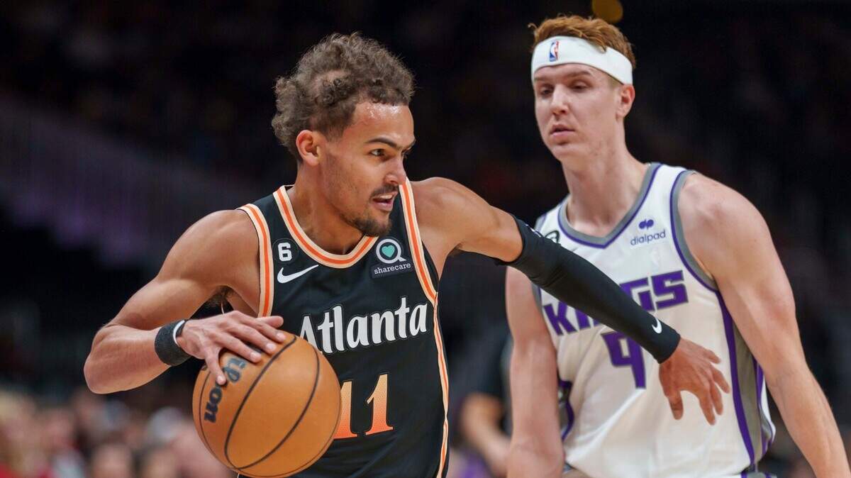 Atlanta Hawks guard Trae Young (11) guards the ball against Sacramento Kings guard Kevin Huerter (9) during the first half of an NBA basketball game on Wednesday, Nov. 23, 2022, in Atlanta. (AP Photo/Erik Rank)