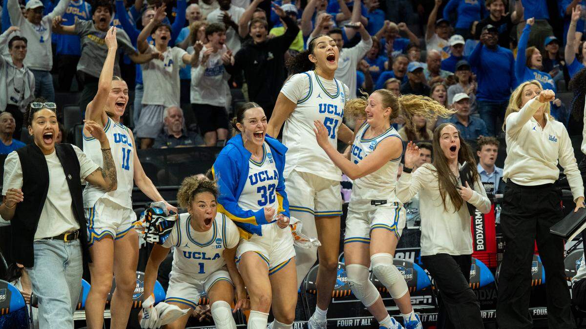 UCLA Bruins guard Gabriela Jaquez (11), guard Kiki Rice (1), forward Angela Dugalic (32), center Lauren Betts (51) and guard Gianna Kneepkens (8) celebrate beating the Minnesota Golden Gophers, 80-56, during the NCAA Women’s Basketball Tournament Sweet 16 game at Golden 1 Center in Sacramento on Friday.