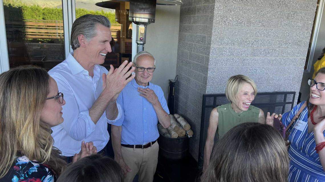 Gov. Gavin Newsom talks with Democrats at a fundraiser in Boise, Idaho, last month.