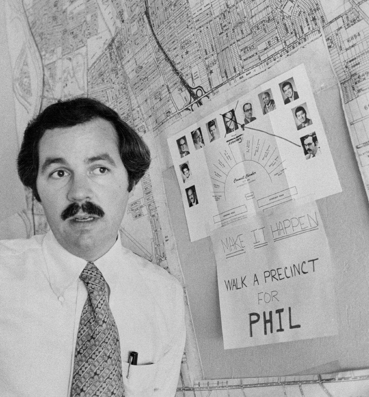 Sacramento City Councilman Phil Isenberg strategizes in August 1975 for his successful bid to replace Richard H. Marriott – whose photograph is crossed out in the background – as mayor.