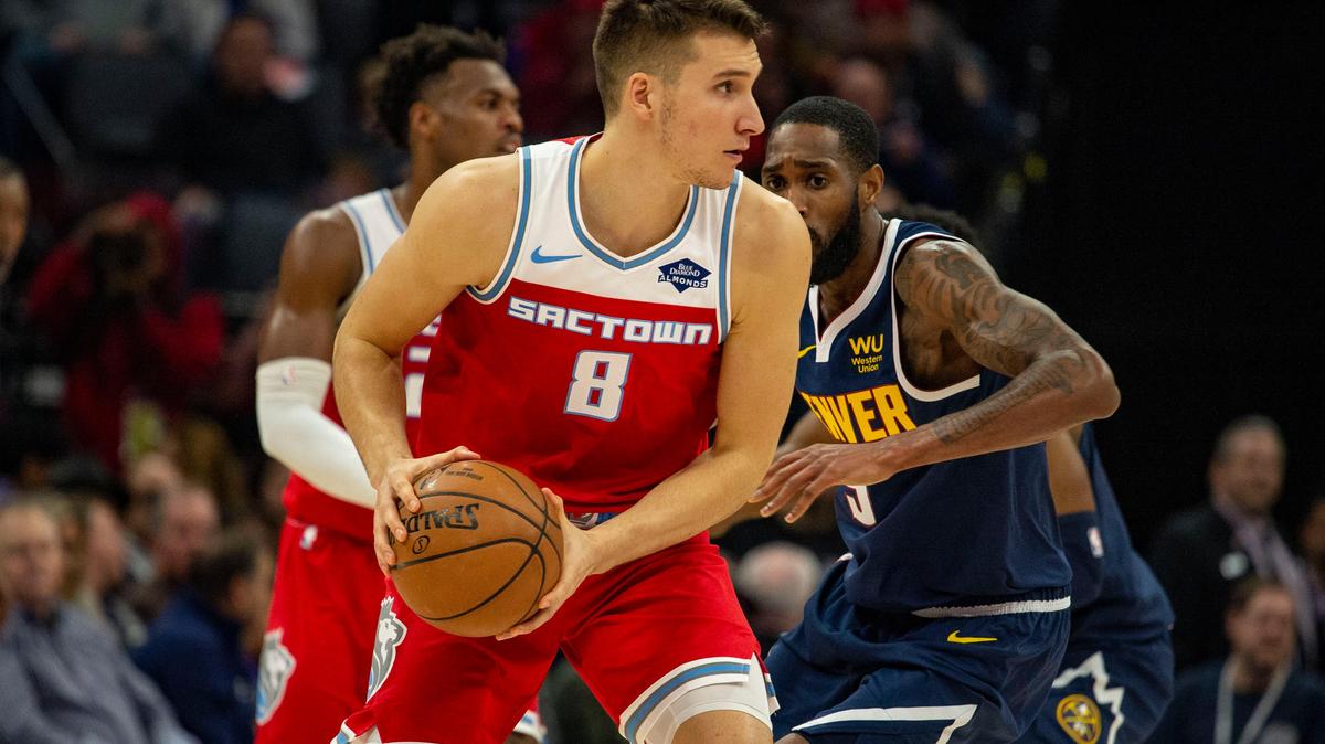 Sacramento Kings guard Bogdan Bogdanovic (8) looks to pass the ball Saturday, Nov. 30, 2019, during the game against the Denver Nuggets at Golden 1 Center.