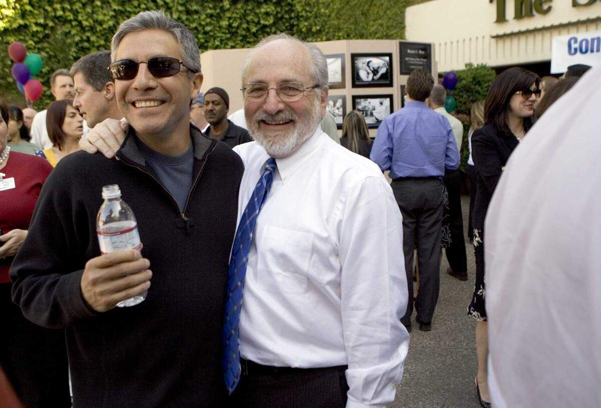 Photographer José Luis Villegas and Deputy Managing Editor Mort Saltzman celebrate in the courtyard of The Bee’s previous offices in 2007 after Renée C. Byer won the Pulitzer Prize for feature photography.