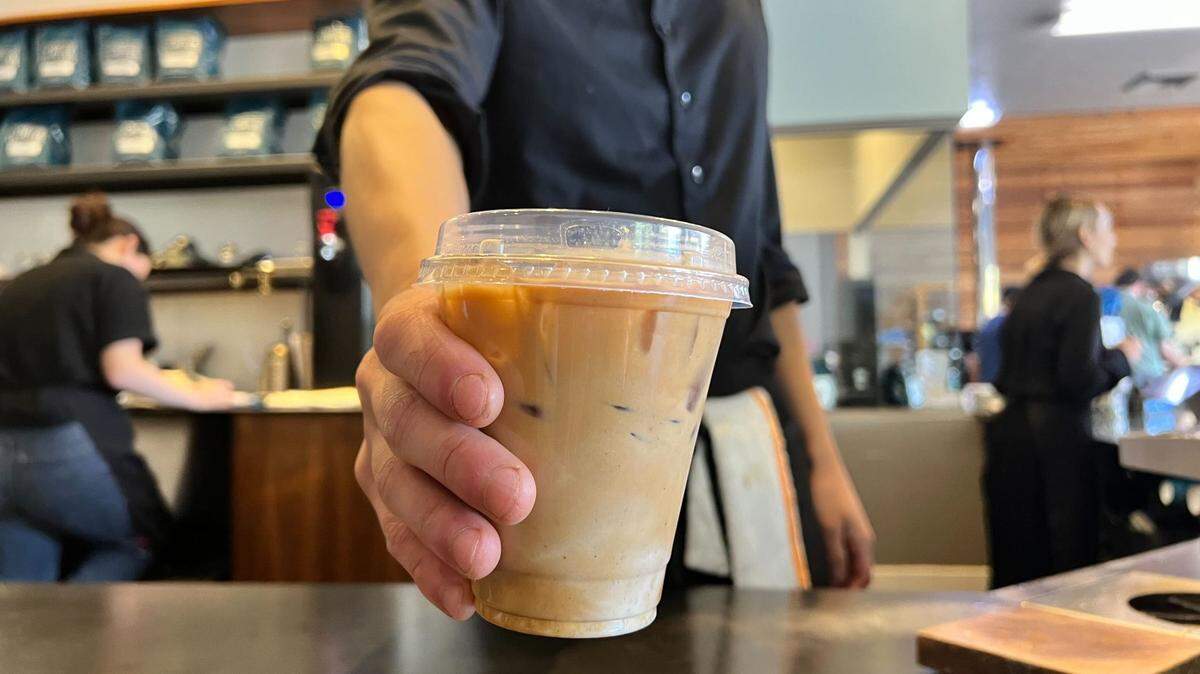 Kevin Robles, lead barista at Chocolate Fish Coffee Roasters at 4749 Folsom Blvd. presents the latest fall menu item: a Fall Flat White with Pumpkin Chai.