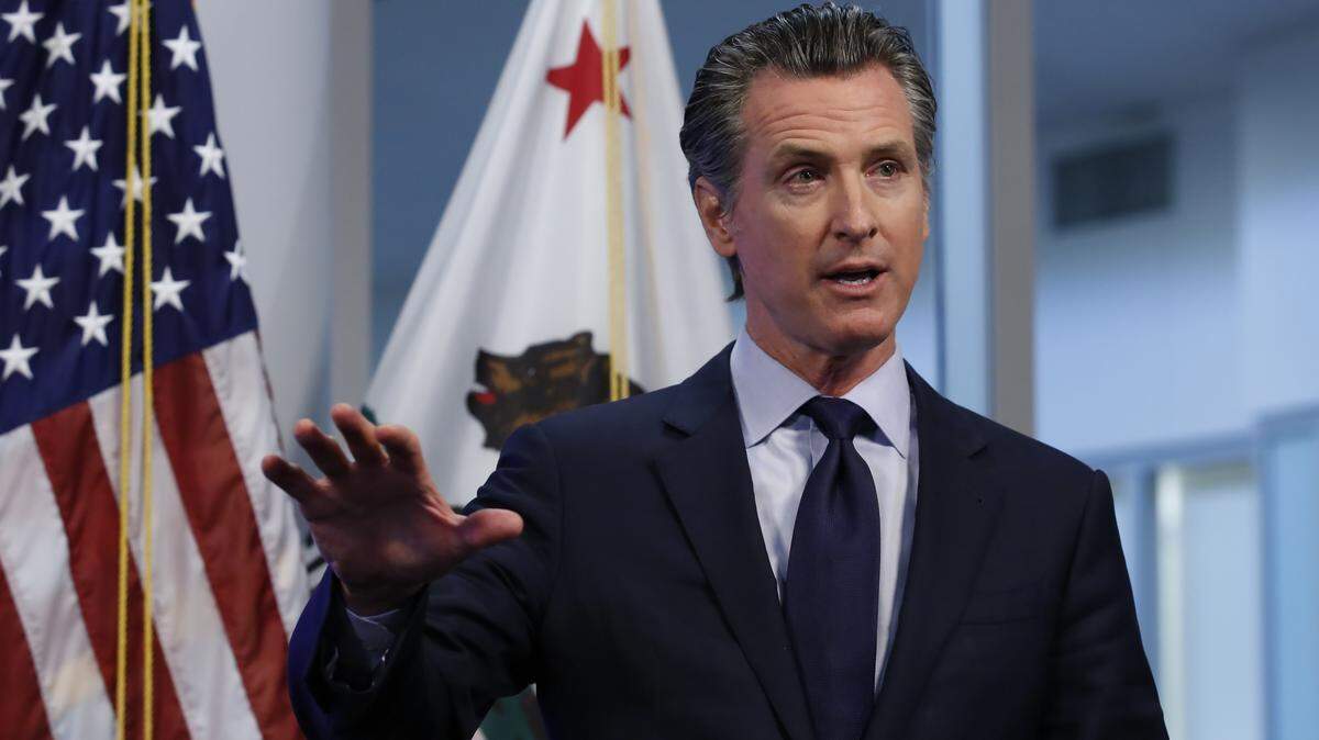 California Gov. Gavin Newsom discusses an outline for what it will take to lift coronavirus restrictions during a news conference at the Governor’s Office of Emergency Services in Rancho Cordova, Calif., Tuesday, April 14, 2020. Newsom said he won’t loosen the state’s mandatory stay-at-home order until hospitalizations, particularly those in intensive care units, “flatten and start to decline.”(AP Photo/Rich Pedroncelli, Pool)