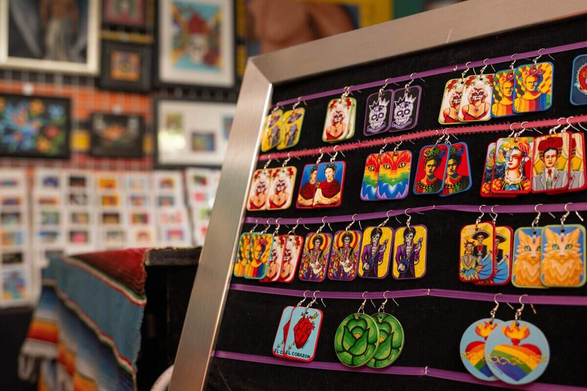 Hand-painted earrings inspired by Frida Kahlo and created by John S. Huerta are displayed in his studio at Placita MX in Sacramento on Wednesday. Located on K Street in midtown Sacramento, Placita MX is a plaza featuring Latino-owned businesses, murals, crafts and Indigenous healing practices centered on community and cultural traditions.
