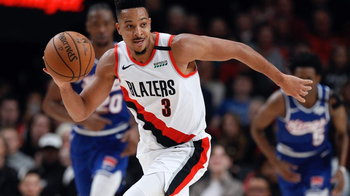 Portland Trail Blazers guard CJ McCollum pushes the ball upcourt against the Sacramento Kings during the first half of an NBA basketball game in Portland, Ore., Saturday, March 7, 2020. (AP Photo/Steve Dipaola)