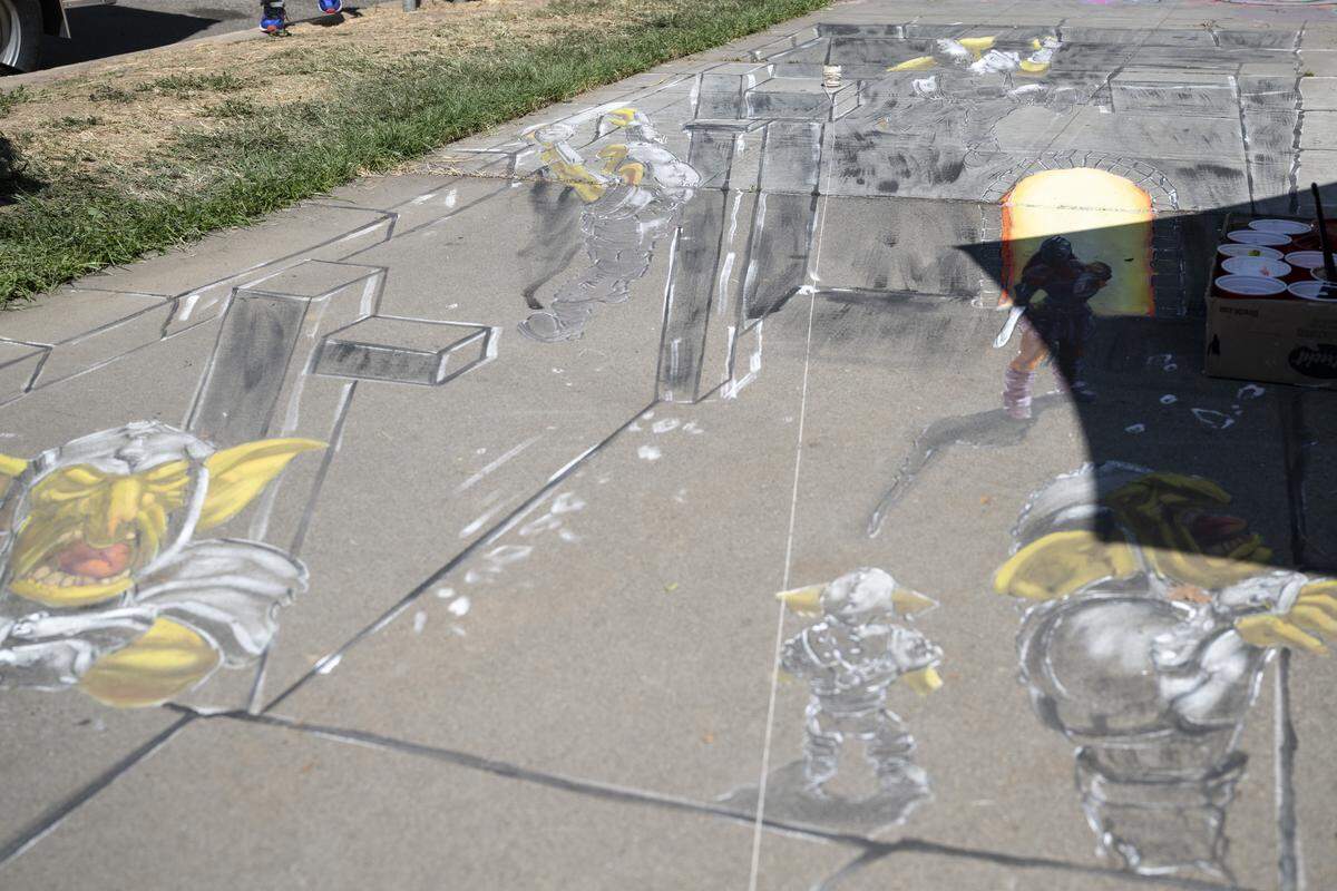 A 3D chalk drawing by artist Nestor Mendoza is in progress during Chalk It Up art festival at Fremont Park in Sacramento on Sunday.