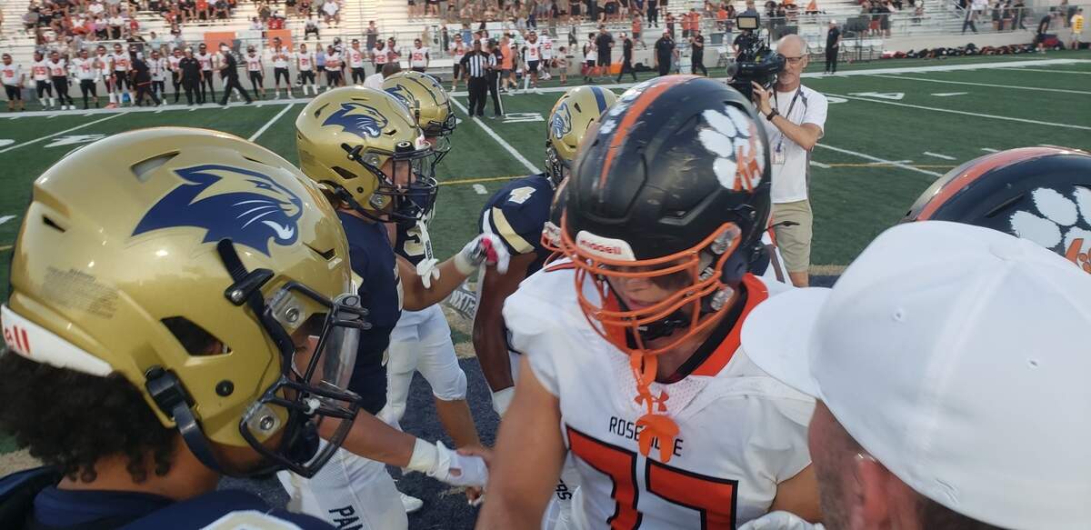 West Park and Roseville captains shake hands before the inaugural football meeting between the two Roseville schools on Friday, Sept. 6, 2024, at West Park High School.