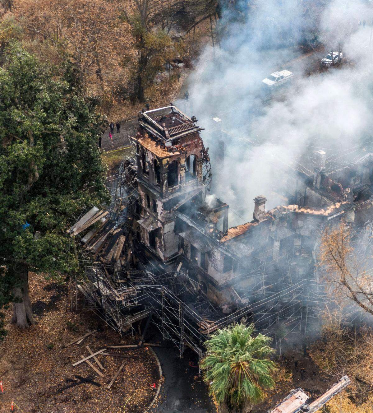 The historic Bidwell Mansion in Chico smolders after a devastating fire on Wednesday, Dec. 11, 2024.
