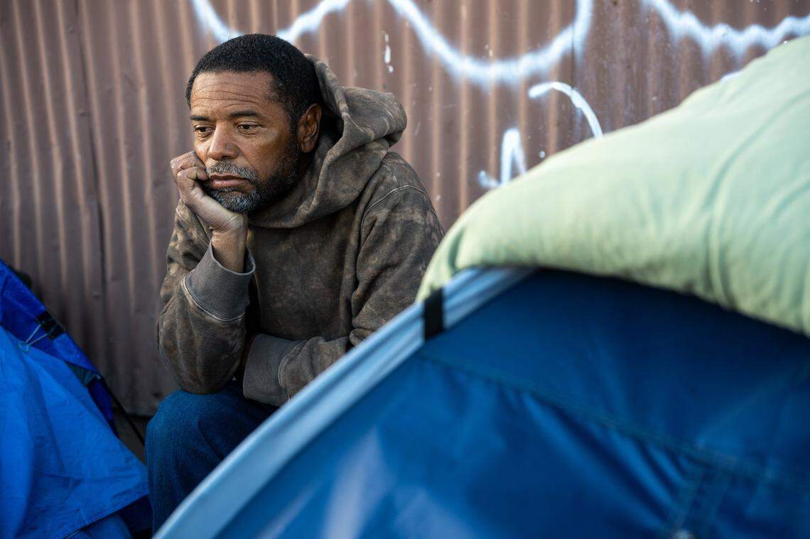 Ron Green sits near his tent, wondering what good citations will do for the homeless in Sacramento, in November. “What are they trying to do? Fill up the prison system with all sorts of petty crimes?” said Green, 57. “I’m on the waiting list for housing and shelter. This is not the answer.”