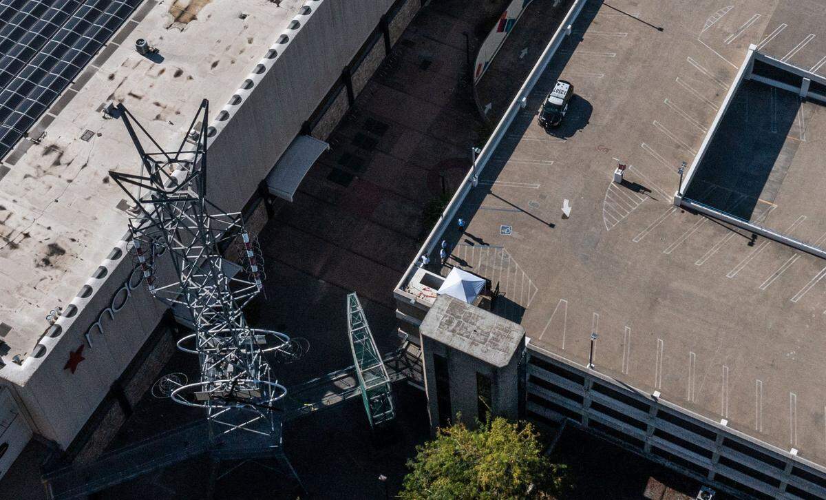 A pop-up tent stands Tuesday, Sep. 12, 2023, were a man who barricaded himself atop a downtown Sacramento parking garage was fatally shot by police during a standoff. The incident began just after 1 a.m. when the man was reported in the Downtown Plaza West parking garage at Third and L streets with a weapon.