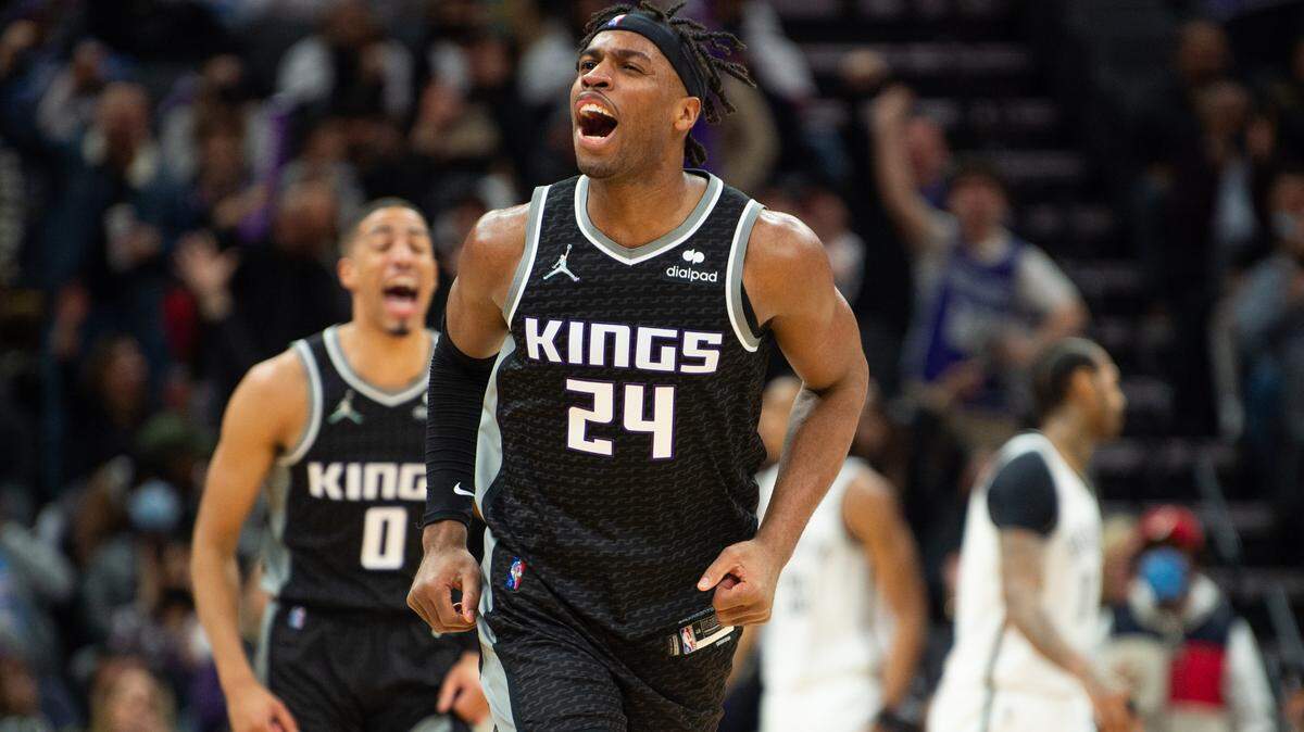 Sacramento Kings guard Buddy Hield (24) and Sacramento Kings guard Tyrese Haliburton (0) reacts after basket in the fourth quarter against the Brooklyn Nets during at game at Golden 1 Center on Wednesday, Feb. 2, 2022 in Sacramento.