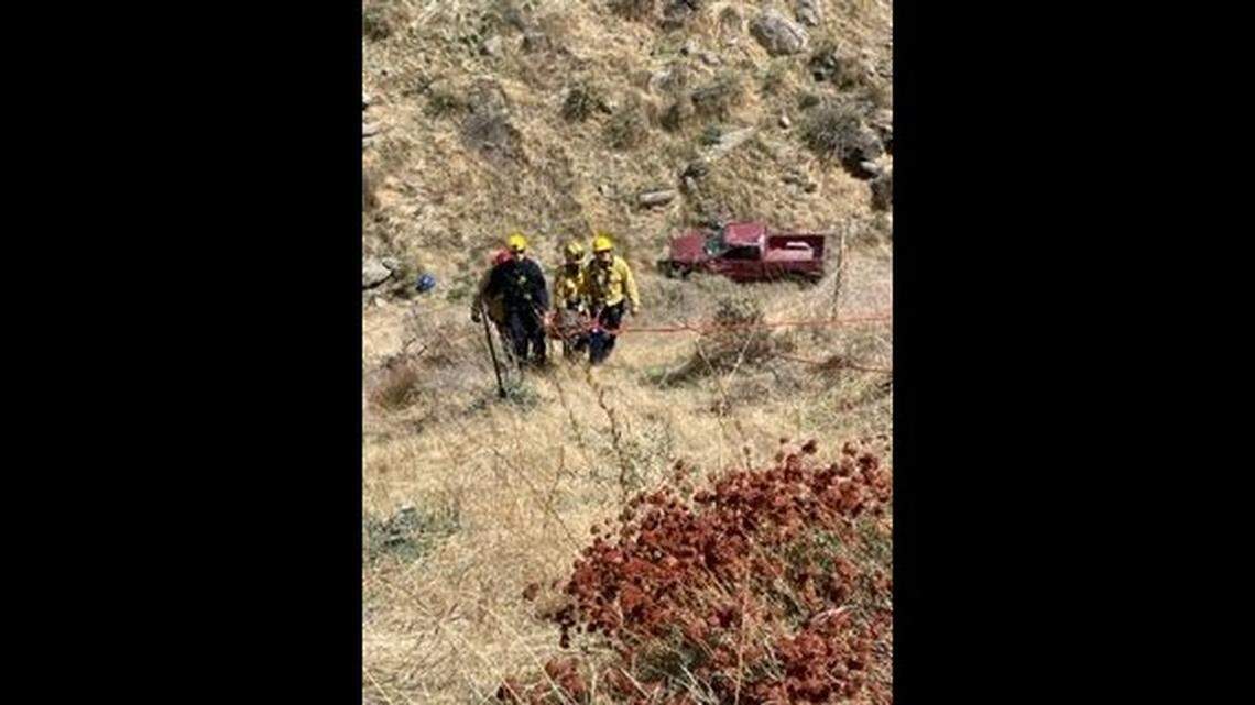 An injured driver spent five days trapped in a pickup truck that crashed into a 100-foot-deep ravine, California firefighters say.