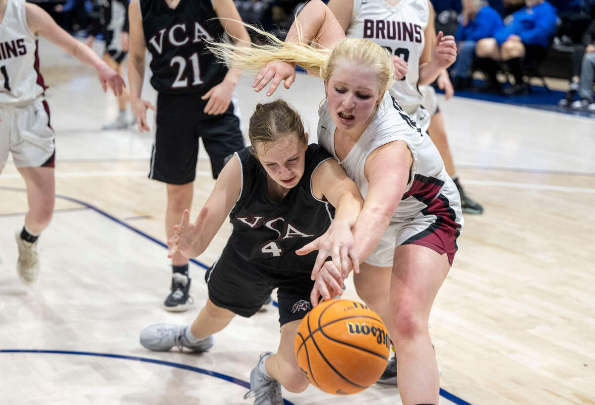 Valley Christian’s Lydia Gunter (4) and Bear River’s Michelle Sams (33) dive for a loose ball during the CIF Sac-Joaquin Section Division V girls basketball championship game on Friday at UC Davis.