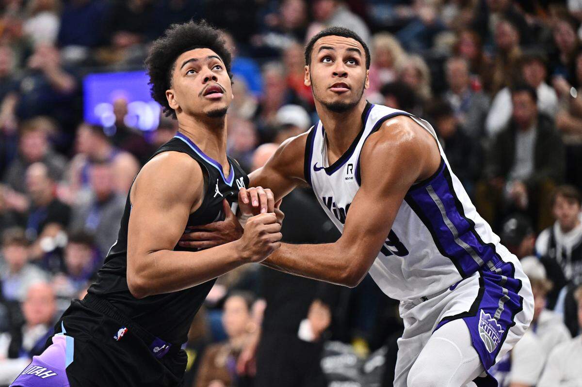 Utah Jazz guard Jaden Springer (11) and Sacramento Kings forward Keegan Murray (13) battle for position for a rebound in the second half Wednesday, Feb. 26, 2025, at Delta Center in Salt Lake City, Utah.