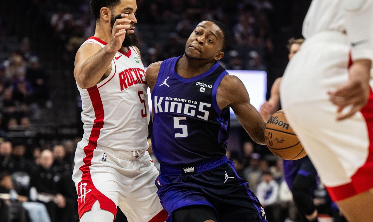 Sacramento Kings guard De’Aaron Fox (5) drives to the basket as he is defended by Houston Rockets guard Fred VanVleet (5) during an NBA game Sunday at Golden 1 Center.