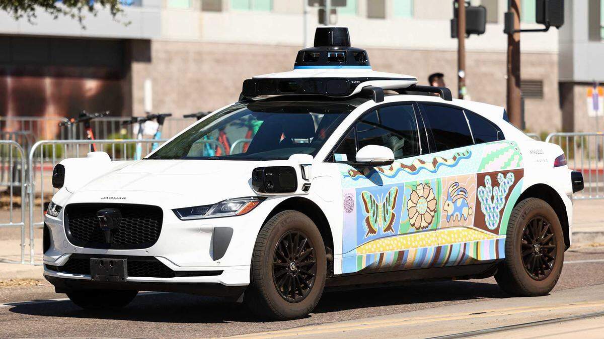 A Waymo self-driving Jaguar electric vehicle is seen in Tempe, Ariz., on the outskirts of Phoenix, on Sept. 15. Waymo’s Sacramento-area testing will use the same vehicle model alongside the Zeekr RT, a Chinese-built robotaxi not previously seen on local roads.