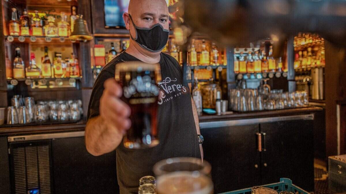 “We had a good run,” said Henry de Vere White, co-owner of de Vere’s Irish Pub, holding a pint in Sacramento on Tuesday. The pub is closing Sunday after suffering losses from the pandemic “It’s a business choice to do this, as heartbreaking as it is,” he said.