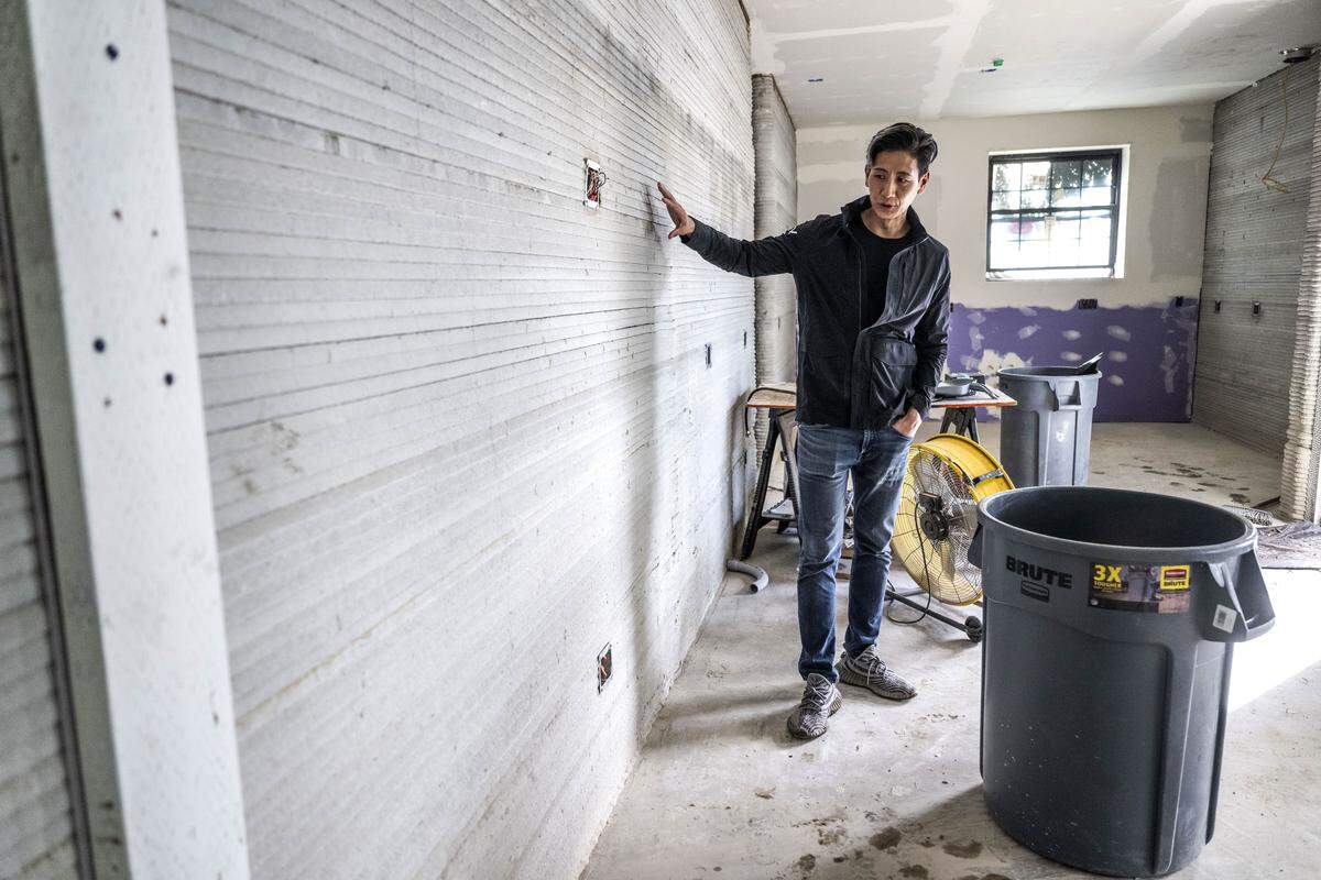 Nan Lin, the project developer and owner of 4dify, stands in the living room area of the first 3D printed home in Yuba County on Thursday.