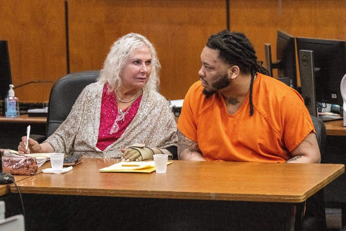 Defense attorney Linda Parisi speaks with defendant Dandrae Martin during a preliminary hearing in Sacramento Superior Court on Friday. Martin is facing murder changes stemming from the 2022 gang-related shootout on K Street that killed six people. His older brother Smiley died in custody in June, and the charges against him were dropped on Friday.