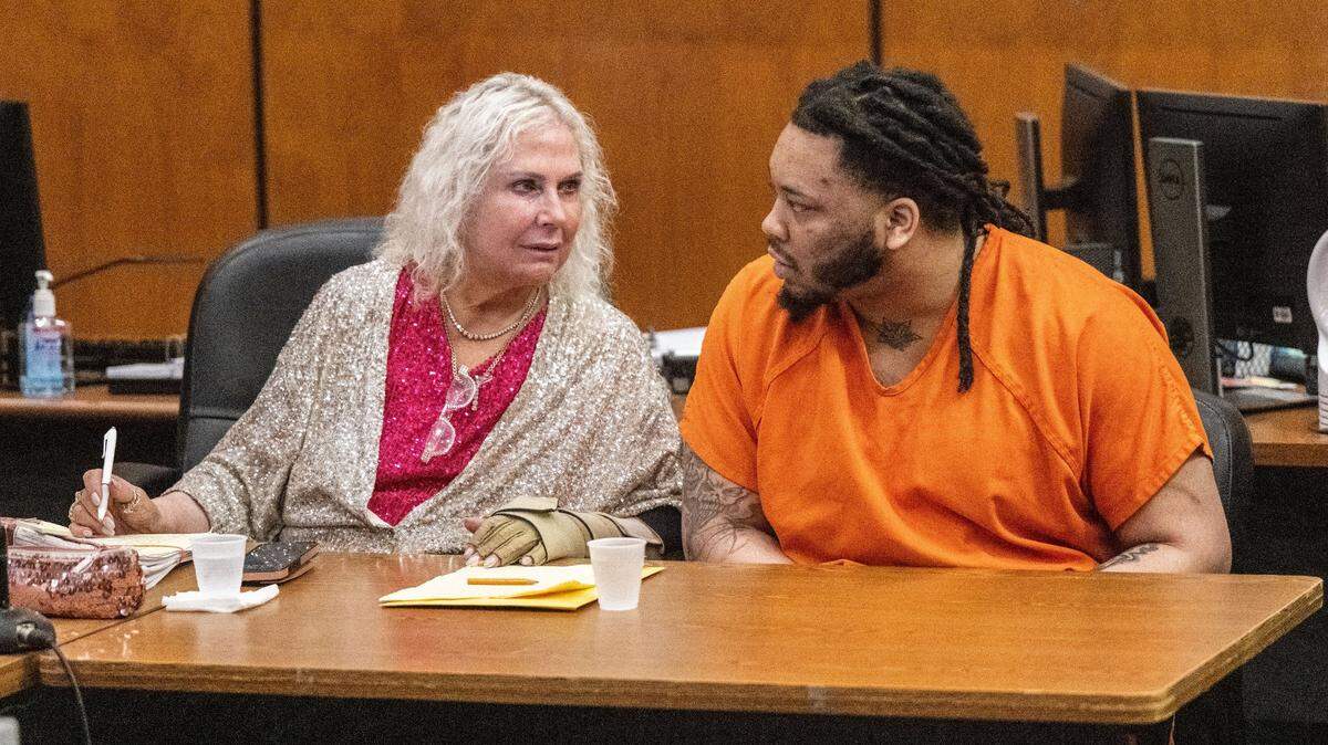 Defense attorney Linda Parisi, left, speaks with defendant Dandrae Martin during a preliminary hearing in Sacramento Superior Court in 2024. Martin is on trial for murder in connection with the April 3, 2022, downtown Sacramento mass shooting that left six people dead.