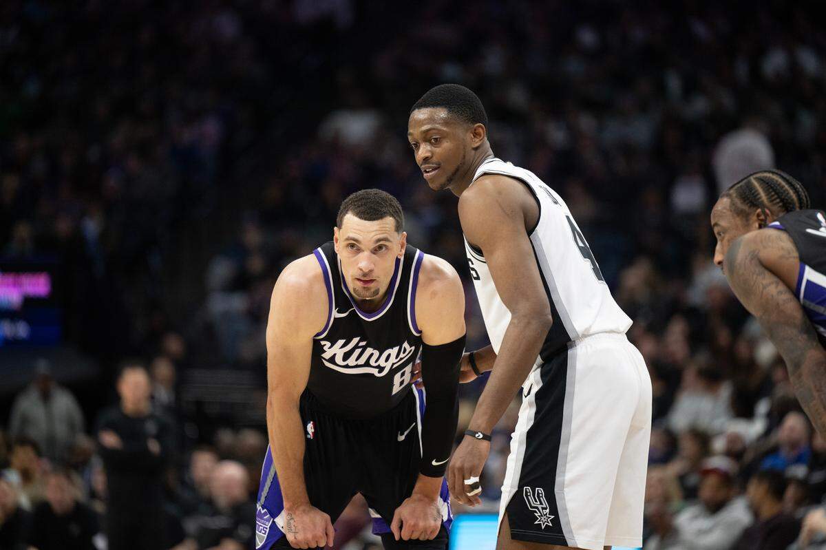 San Antonio Spurs guard De’Aaron Fox (4) defends Sacramento Kings guard Zach LaVine (8) before the Kings inbound the ball in the second half on March 7.