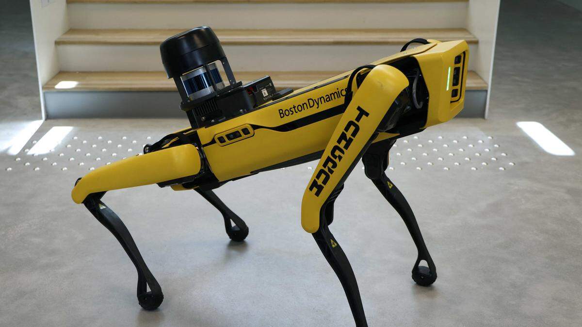 A Boston Dynamics robot dog equipped for security walks down stairs at a university in Marseille, France, in 2024. Caltrans has used similar semi-autonomous robots with added surveillance equipment during a pilot program to monitor after-hours activity at a San Bernardino maintenance yard.