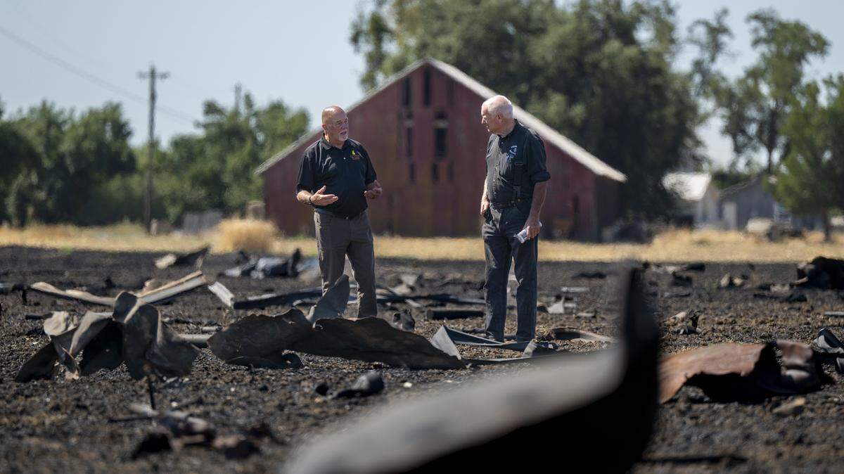 Fire investigators examine debris from the Devastating Pyrotechnics explosion in a nearby field in Esparto on July 21 weeks after the explosion on July 1, 2025.