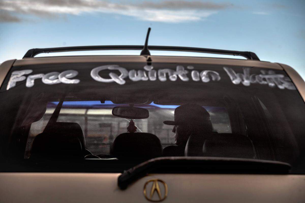 Eric French waits inside a van Wednesday, Feb. 3, 2021, with his partner Rhonda Glaser at the Vacaville/Fairfield Amtrak station for Quinton Watts to be free after almost 12 years in California State Prison-Solano. French was in a dorm with Watts and said when he heard his story in bible study group, he began to get the ball rolling for his release. “The guy has done years in prison for having a seizure at best,” said French. Rhonda Glaser painted “Free Quintin Watts,” on her van several months ago in hopes of getting attention to his case.
