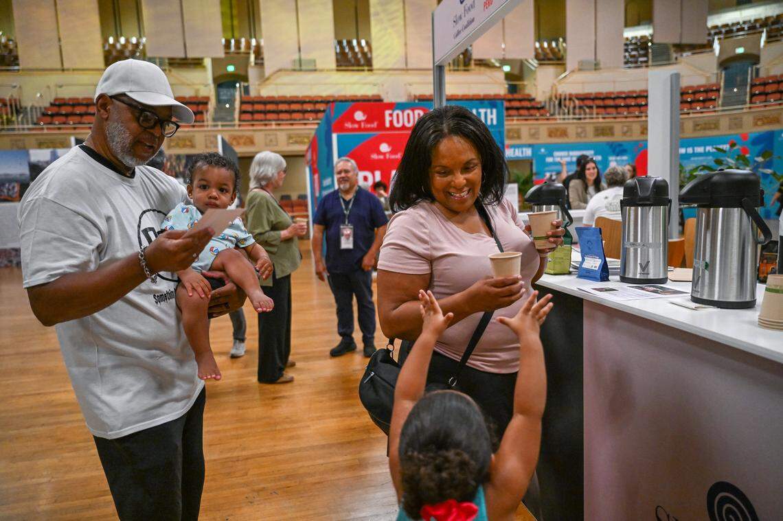 Regina Carr of Sacramento holds cups of Peruvian coffee she was tasting in May 2024 at the inaugural Terra Madre Americas event at Sacramento Memorial Auditorium. Visitors had the opportunity to explore three key slow food themes – coffee, wine and biocultural territories – and learn from experts at the event, which is sponsered by Slow Food, an organization founded in Italy that promotes traditional cooking and local ingredients. 