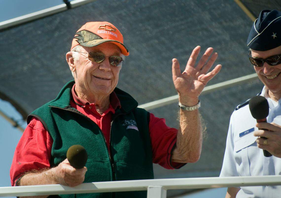 Gen. Chuck Yeager waves to the crowd after being introduced at the Beale Air Force Base air show on Sunday, April 19, 2009.