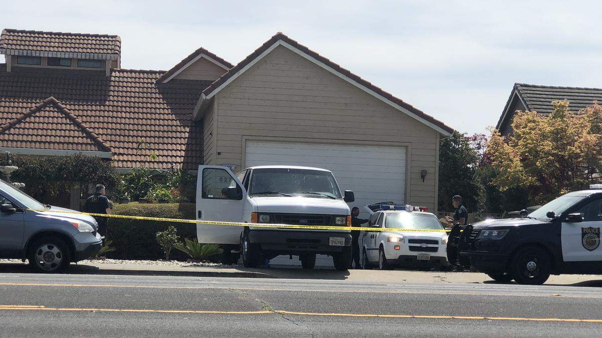 Sacramento police personnel investigate a double-fatal shooting Friday in the 6200 block of Riverside Boulevard in the Greenhaven area of Sacramento.