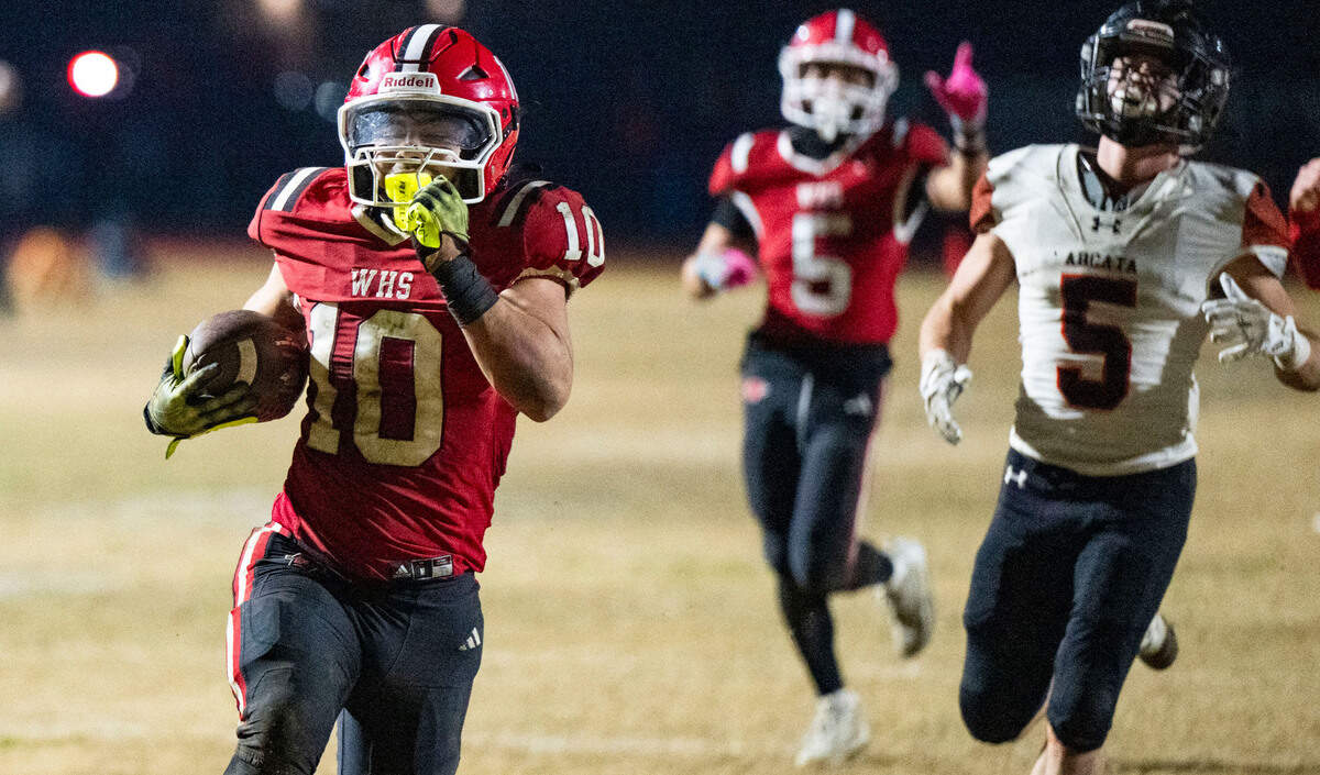 The Winters Warriors’ Gio Jimenez (10) races for a 55-yard touchdown after a short pass in the third quarter against the Arcata Tigers during the CIF Northern California Division 6-AA regional football championship game on Friday.