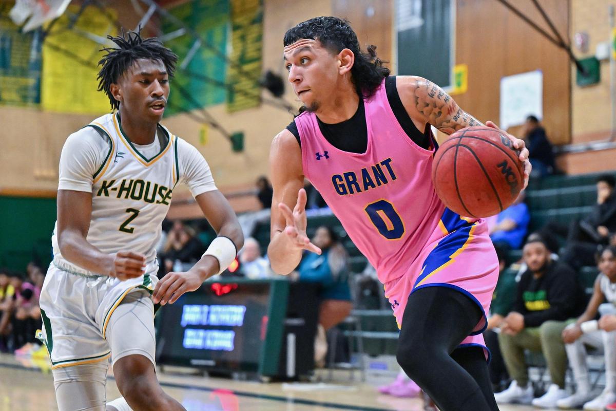 Grant Pacers guard Andre Gomez (0) drives the baseline past Kennedy Cougars guard Noah Hayes II (2) during the first half of the game on Wednesday, Jan. 17, 2024, at Kennedy High School in Sacramento.