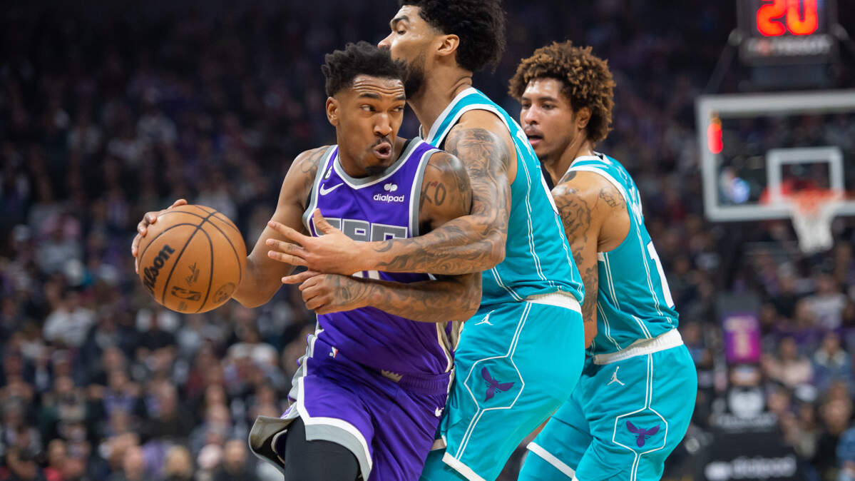 Sacramento Kings guard Malik Monk (0) draws the foul on Charlotte Hornets center Nick Richards (4) driving to the basket and makes one of two free throws during the first quarter in the NBA basketball game Monday, Dec. 19, 2022, at Golden 1 Center in Sacramento. Monk had 12 points. The Hornets won 125-119.