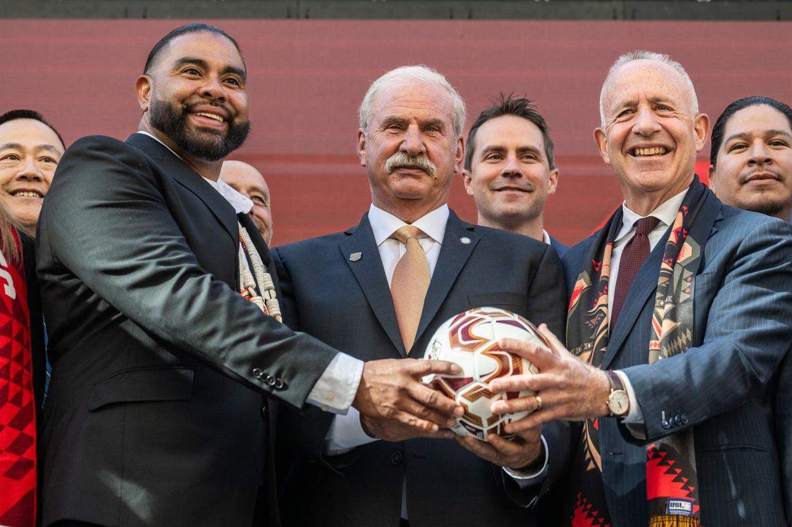 Wilton Rancheria Chairman Jesus Tarango, left, holds a soccer ball with Republic FC Chairman Kevin Nagle, center, and Sacramento Mayor Darrell Steinberg on Thursday after the announcement that the tribe has become the majority owner of the team and will help build a new, state-of-the-art soccer stadium and entertainment district in Sacramento’s downtown Railyards.