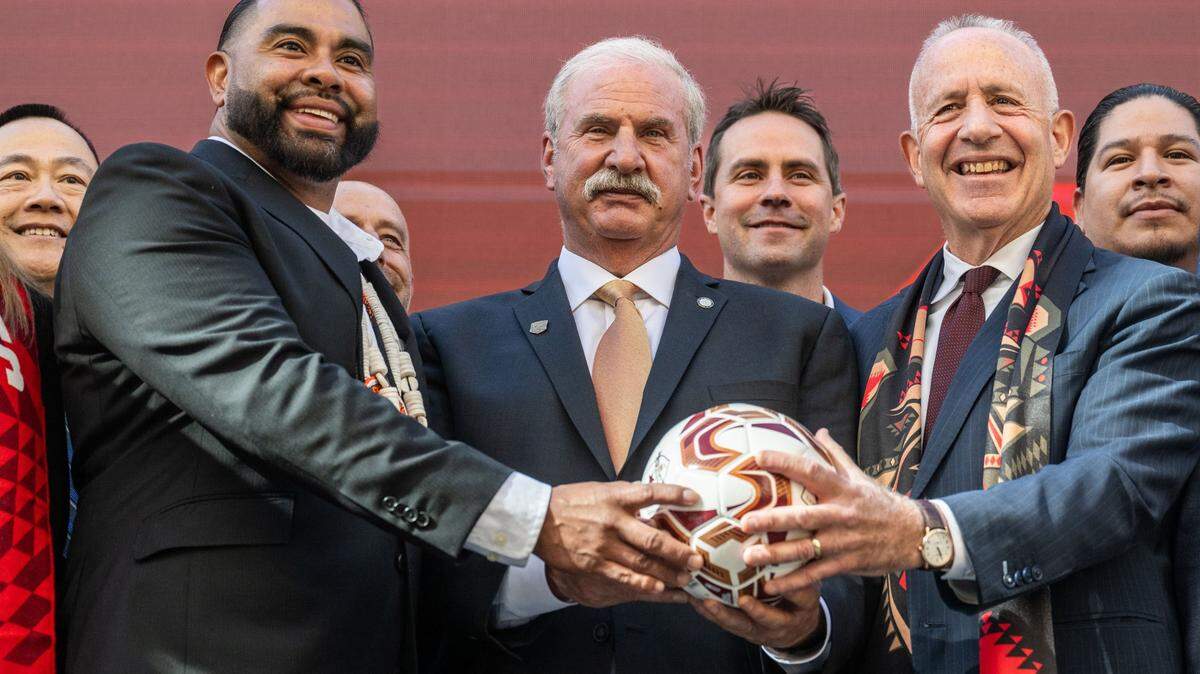 Wilton Rancheria Chairman Jesus Tarango, left, holds a soccer ball with Republic FC Chairman Kevin Nagle, center, and Sacramento Mayor Darrell Steinberg on Thursday, Nov. 7, 2024, after the announcement that the tribe has become the majority owner of the team and will help build a new, state-of-the-art soccer stadium and entertainment district in Sacramento’s downtown Railyards.