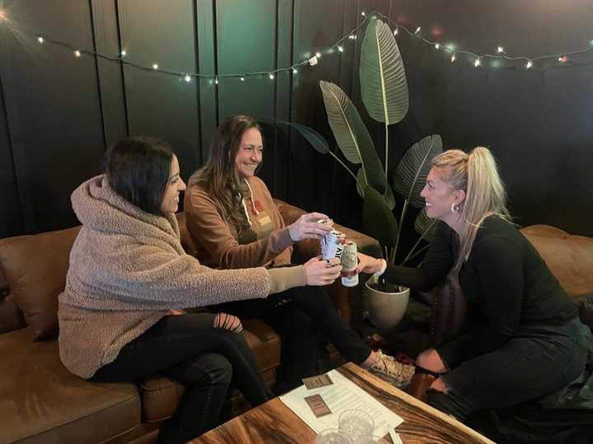 Suha Musallam, from left, Kim Davidson and Stephanie Bozzalla toast to the weekend at The Shop Midtown on Friday. The family behind Vietnamese restaurant Red Beret revamped the space with a new concept and menu.