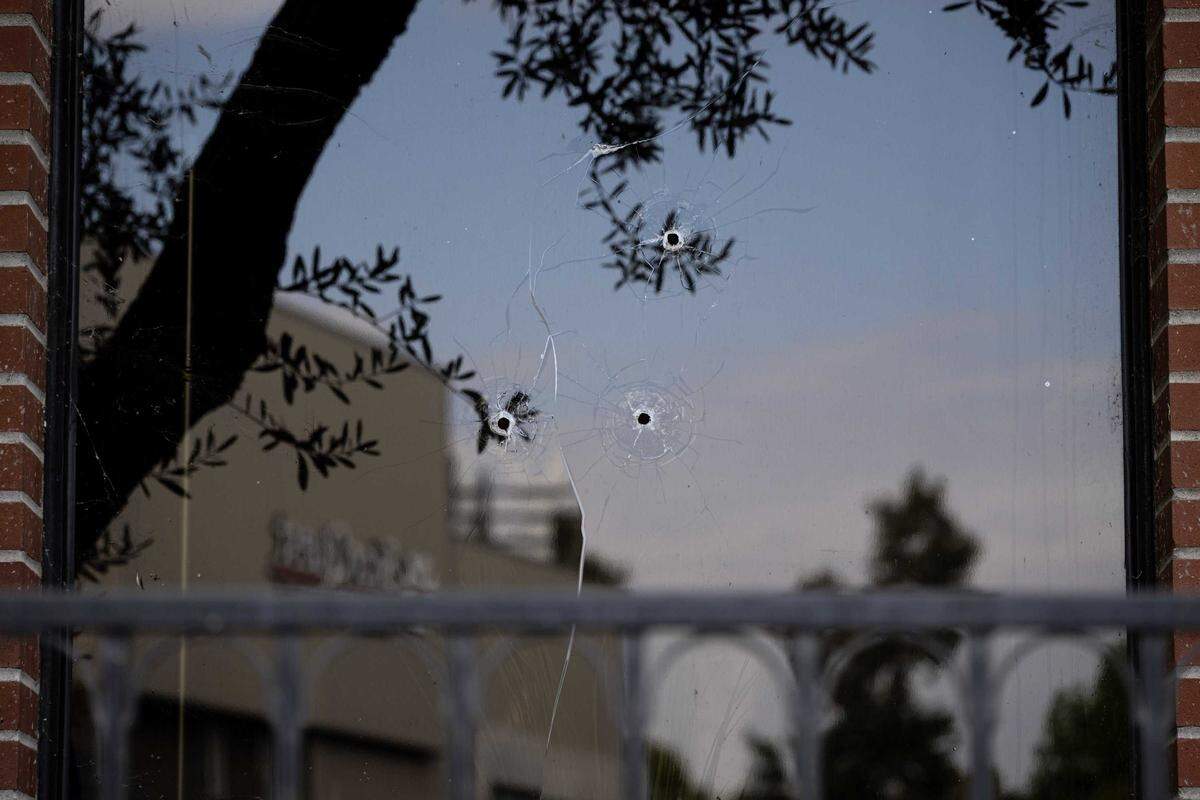 Three shots are visible in a window at the ABC10 offices in Upper Land Park on Friday, Sept. 19, 2025, in Sacramento. Police are investigating after gunfire struck the station one day after a protest over ABC’s suspension of “Jimmy Kimmel Live!” following remarks about the suspect charged in the murder of conservative activist Charlie Kirk.