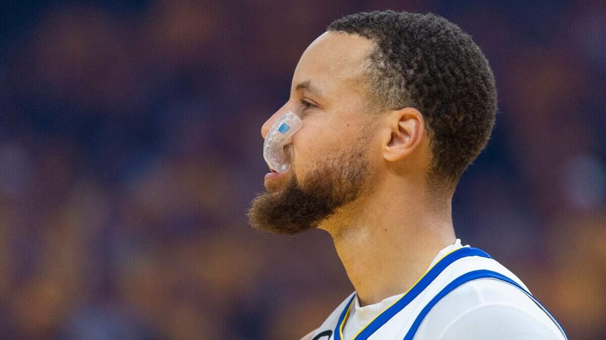 Golden State Warriors guard Stephen Curry (30) chews on his mouthpiece during Game 4 of the first-round NBA playoff series at Chase Center in San Francisco on Sunday.