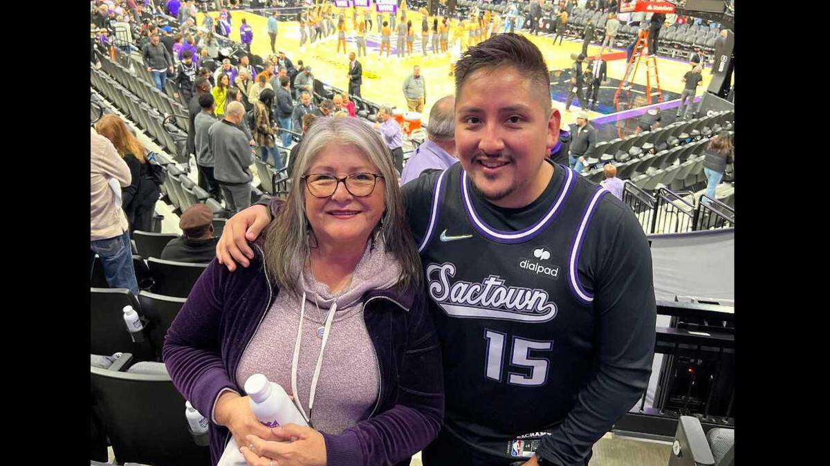 Gregorio “Greg” Florez Breedlove, 34, smiles with his mother, Janet Florez, at a Sacramento Kings game in March. He died Monday after suffering a medical emergency Sacramento Kings game at the Golden 1 Center.