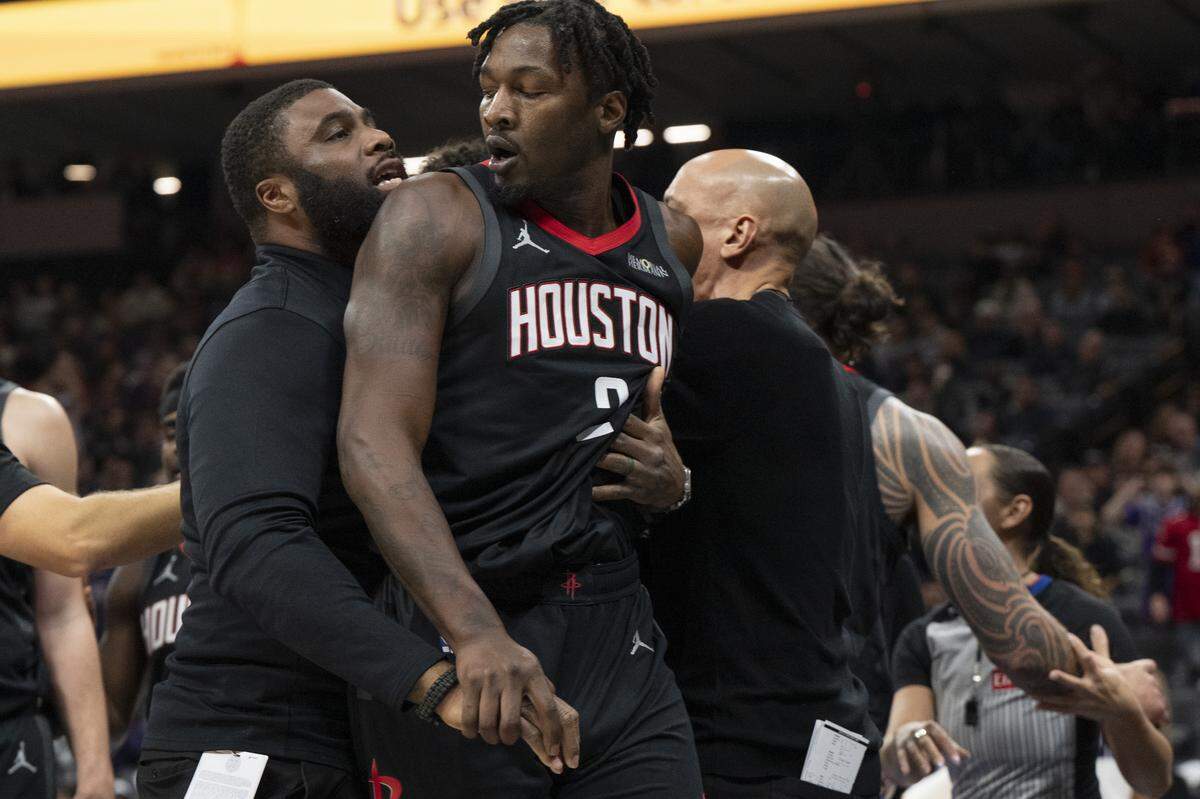 Houston Rockets forward Dorian Finney-Smith (2) is held back after an altercation during a Sacramento Kings game against the Houston Rockets at Golden 1 Center in Sacramento on Sunday, Jan. 11, 2026.