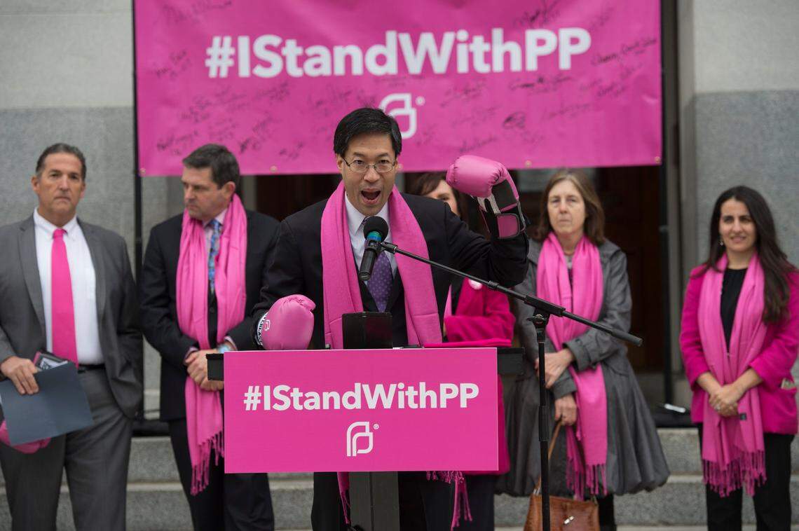 State Sen. Richard Pan, gestures with boxing gloves at a Planned Parenthood rally “Pink Out Day,” at the Capitol in 2017. “If anyone stands in our way I’m going to knock them out,” he said. Addressing teen pregnancy was a key goal early in his career.