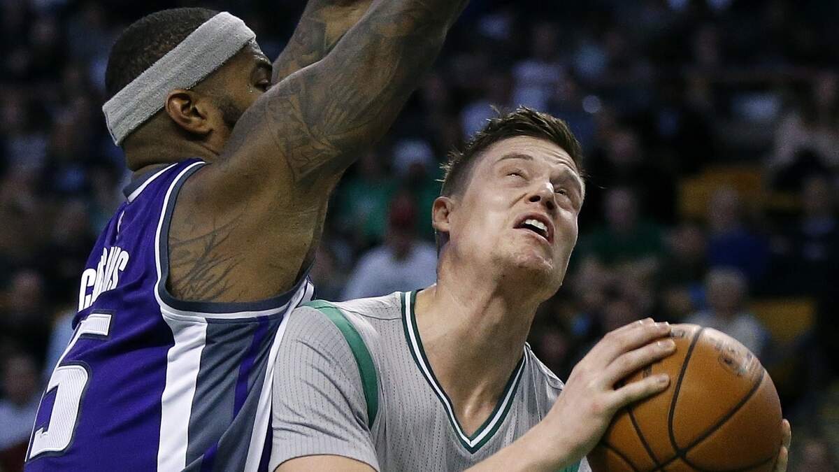 The Kings' DeMarcus Cousins, left, defends against the Boston Celtics' Jonas Jerebko on Dec. 2, 2016 in Boston. They are now teammates with the Golden State Warriors, and both know what it's like to suffer an Achilles injury.