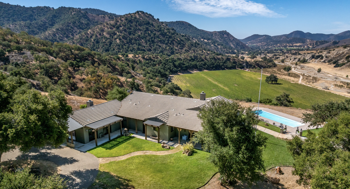 Alamo Creek Ranch in Santa Maria, California, has a 3,000-square-foot main residence and pool set amid a rugged background.