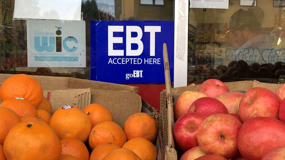OAKLAND, CALIFORNIA - DECEMBER 04: A sign noting the acceptance of electronic benefit transfer (EBT) cards that are used by state welfare departments to issue benefits is displayed at a grocery store on December 04, 2019 in Oakland, California. Nearly 700,000 people are set to lose their food stamp benefits after the Trump administration announced plans to reform the Supplemental Nutrition Assistance Program, or SNAP. (Photo by Justin Sullivan/Getty Images)