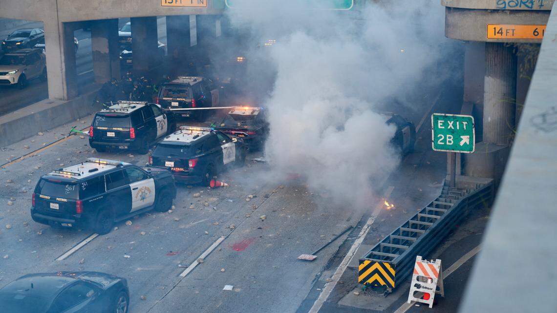 June 8, 2025; Los Angeles, CA, USA; A police car burns under an overpass near Union Station in Los Angeles on June 8, 2025. Clashes between law enforcement and protesters intensified on Sunday as California National Guard troops arrived in Los Angeles to quell demonstrations against President Donald Trump’s immigration crackdown, a move that the state’s Democratic governor has called unlawful. Mangatory Credit: Trevor Hughes-USA TODAY Network via Imagn
