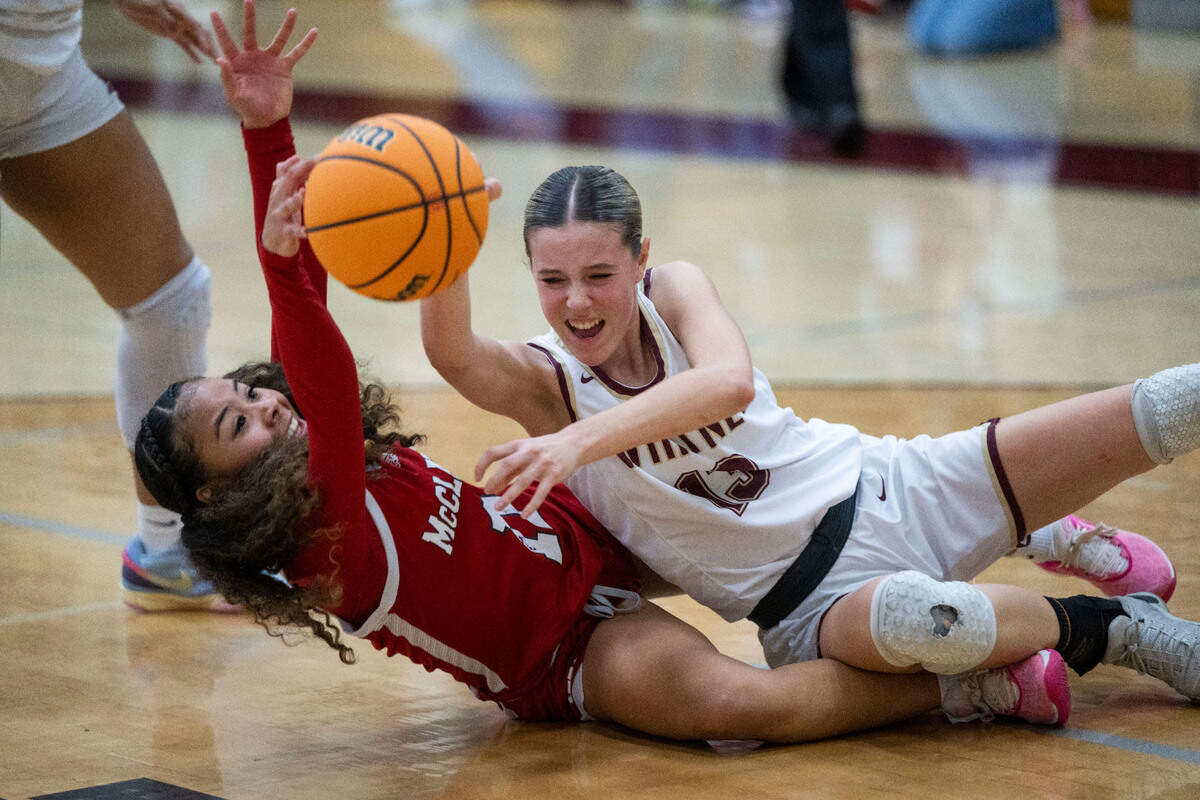 The McClatchy Lions’ Laila Stancil-Williams, left, battles for the ball against the Whitney Wildcats’ Sammy Schuler in a CIF Northern California Regional championship quarterfinal on Thursday at Whitney High School.